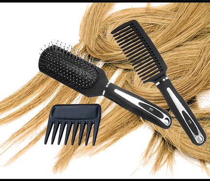 Combs Brush laying on top of long tresses